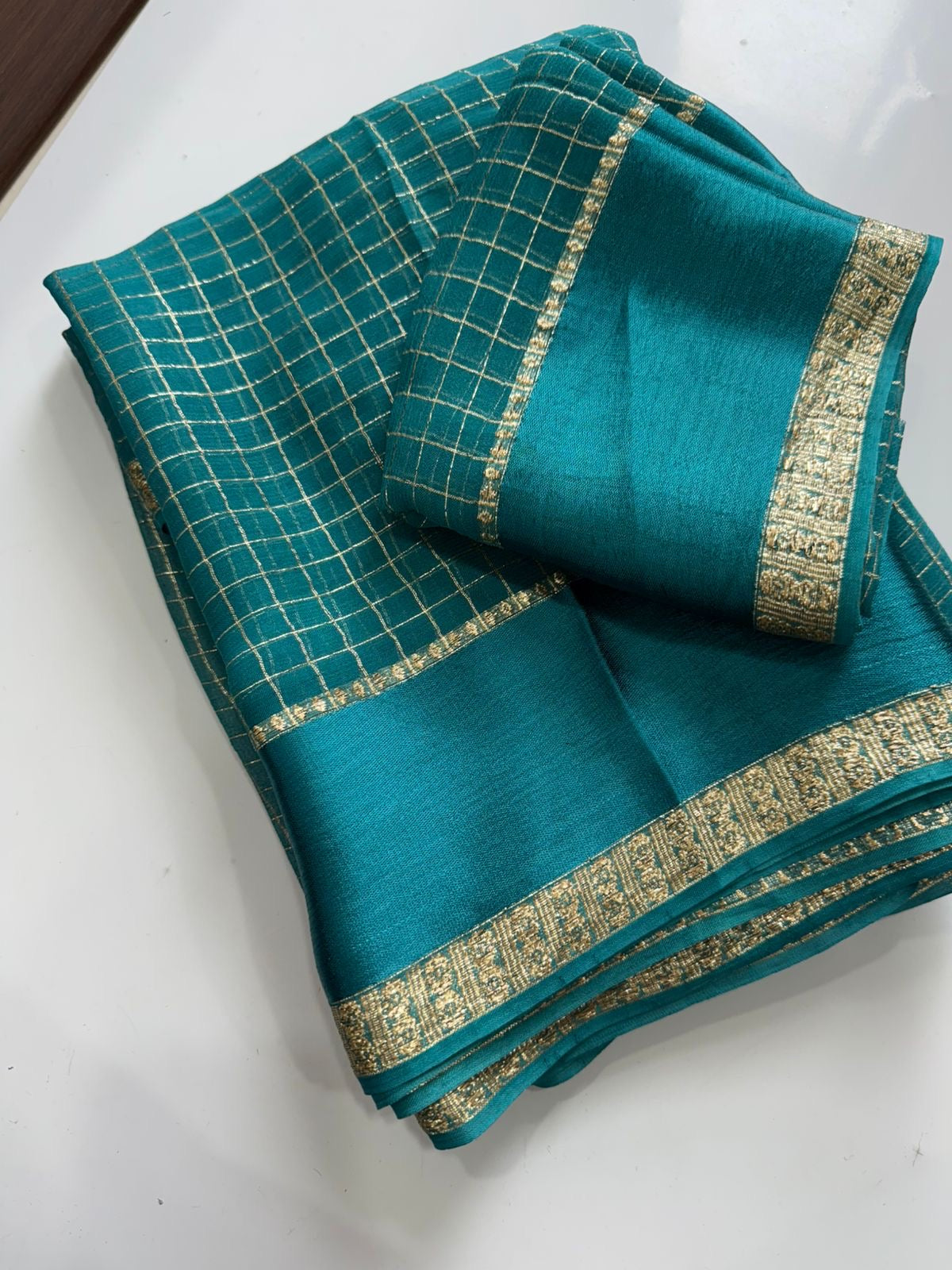 Trendy Laksharaa Sarees AHANA viscose georgette saree with elegant drape and intricate border design, displayed on a mannequin.