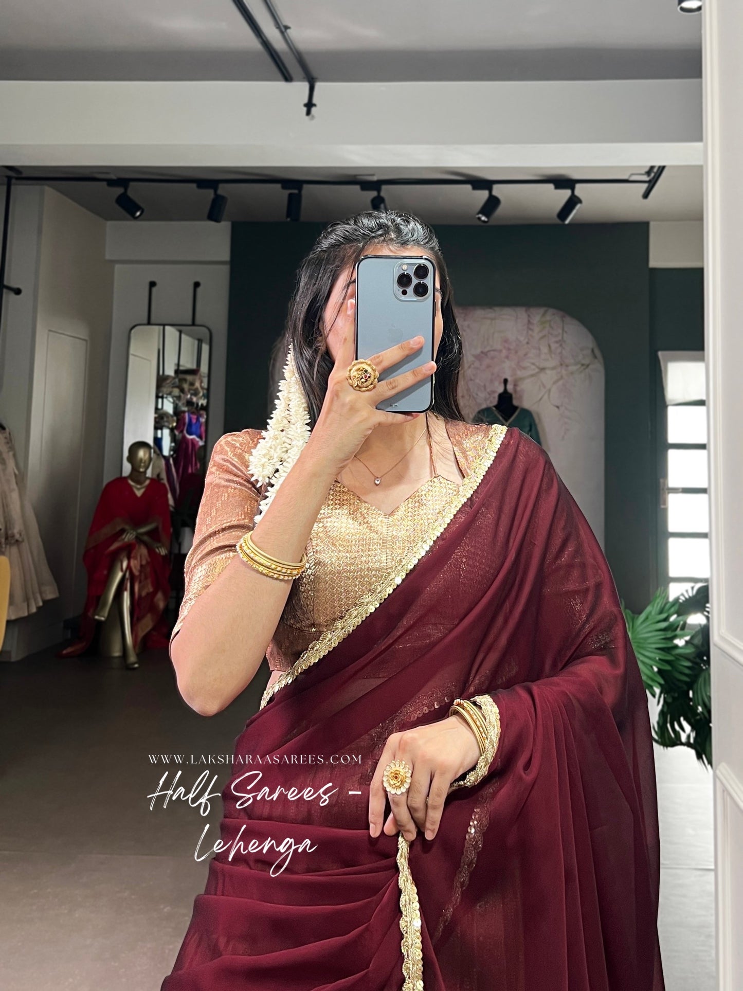 Silky BINDYA 2.0 half saree lehenga by Laksharaa Sarees with intricate embroidery and vibrant colors, displayed on a mannequin.