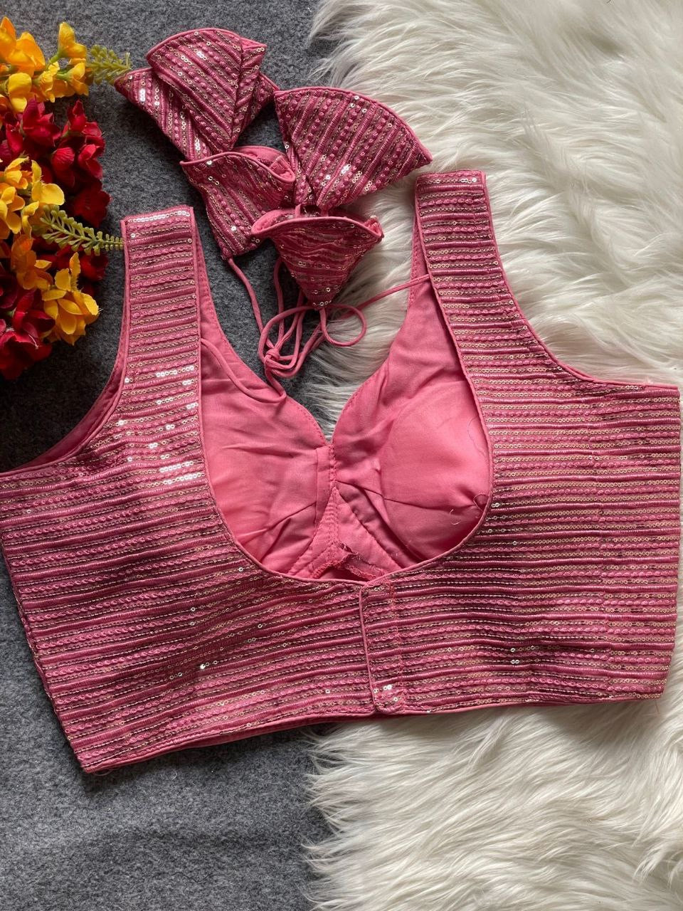 Elegant red partywear readymade blouse by Laksharaa Sarees featuring intricate embroidery and stylish design.