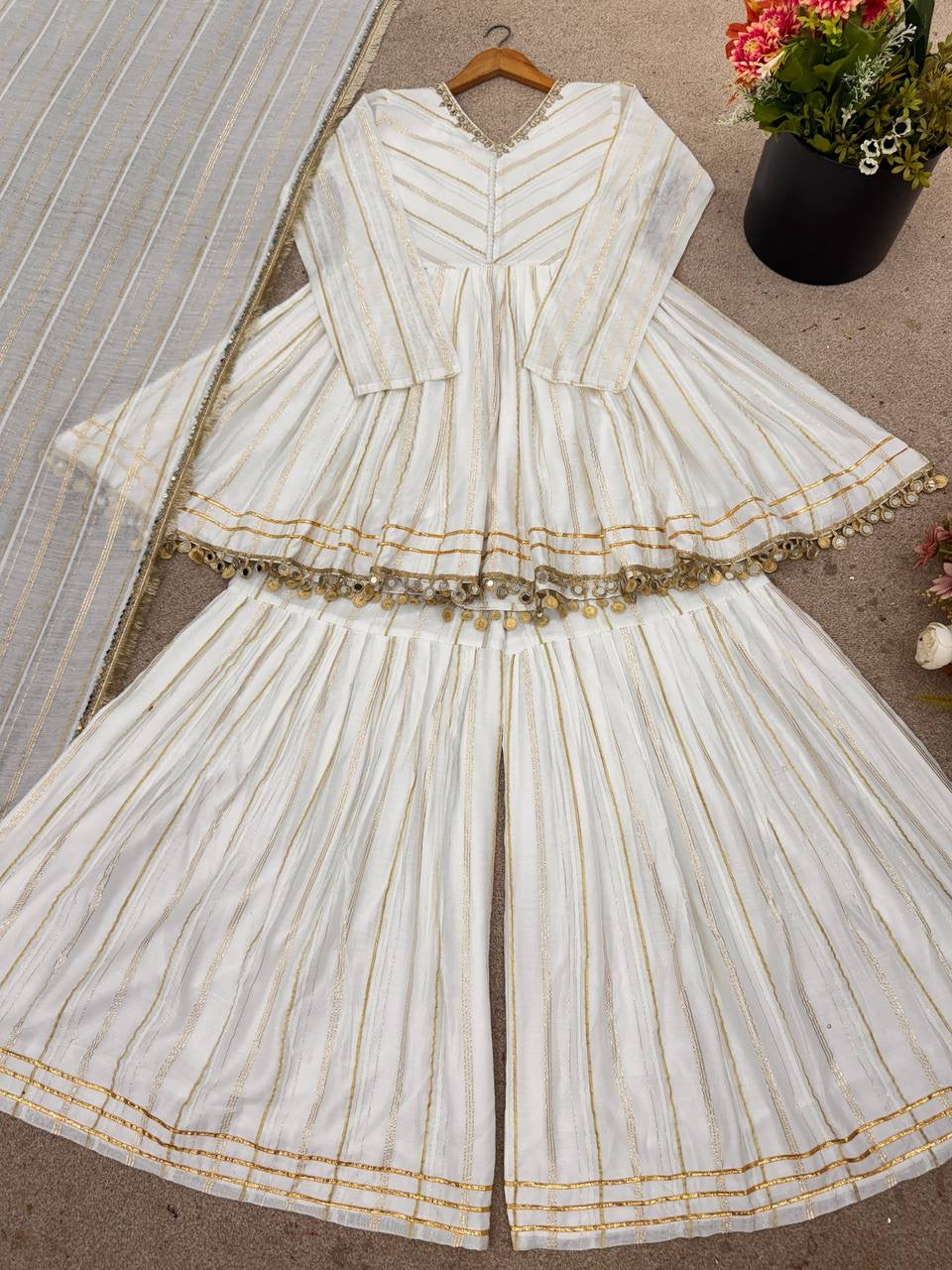 Chanderi peplum style sharara suit by Laksharaa Sarees, featuring intricate embroidery and traditional design with a matching dupatta.