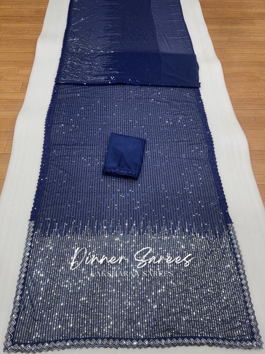 Dark blue partywear saree by Laksharaa Sarees with intricate embroidery and elegant drape, perfect for festive occasions.
