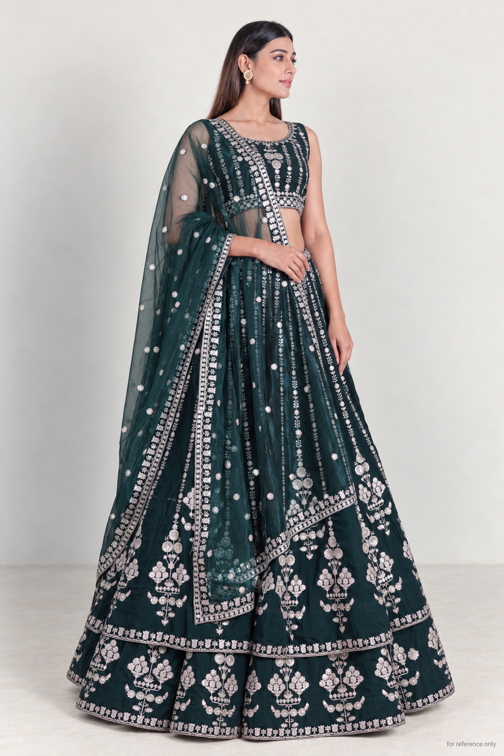 Bottle green georgette lehenga, three-quarter view with net dupatta; for reference only