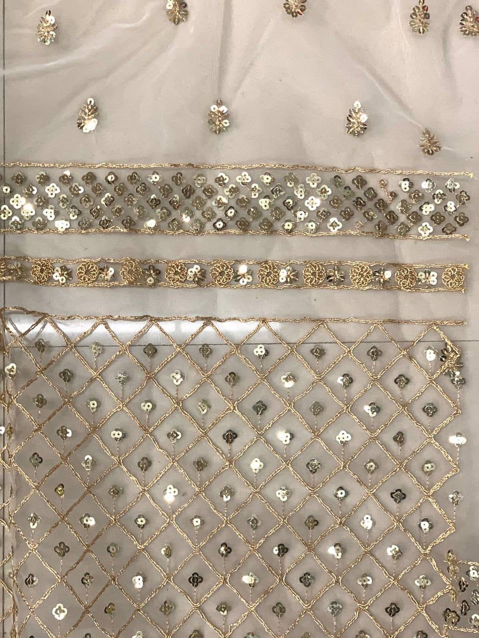 Golden cream stunning Party-wear net sequinned saree