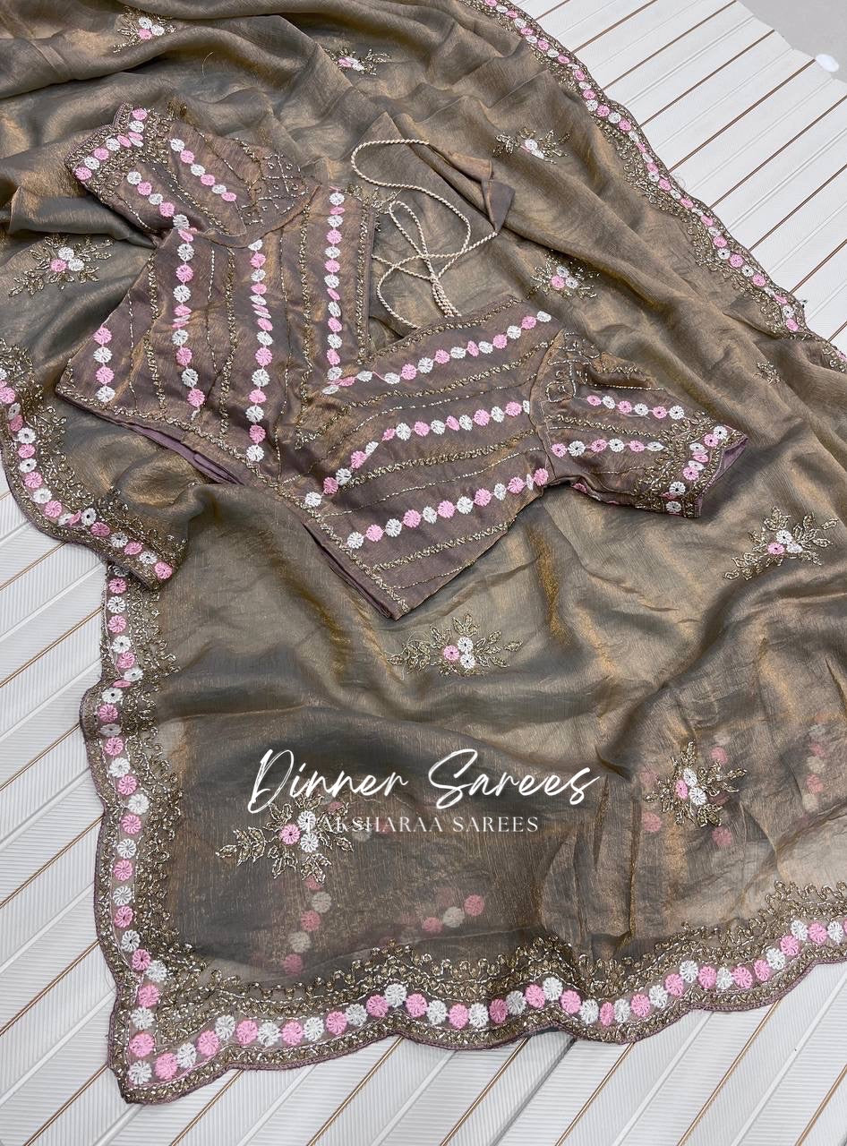 Pink chiffon georgette saree with intricate floral work from Laksharaa Sarees, showcasing elegant drape and detailed embroidery.