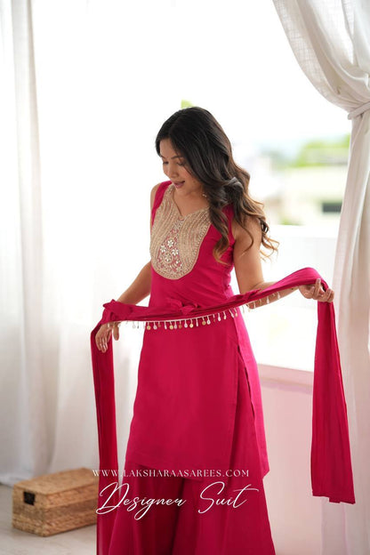 Laksharaa Sarees VARSHI Rani Pink Sharara Suit with Bow Shawl Front View Holding Shawl