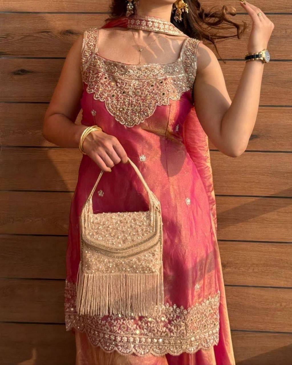 AVIRA Shimmer Silk Suit Coral Worn View with Bag