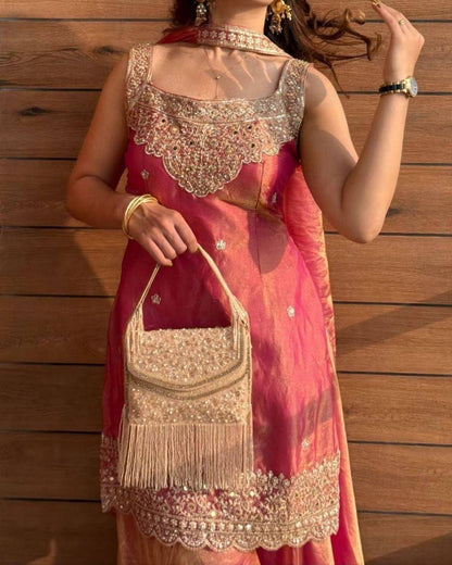 AVIRA Shimmer Silk Suit Coral Worn View with Bag