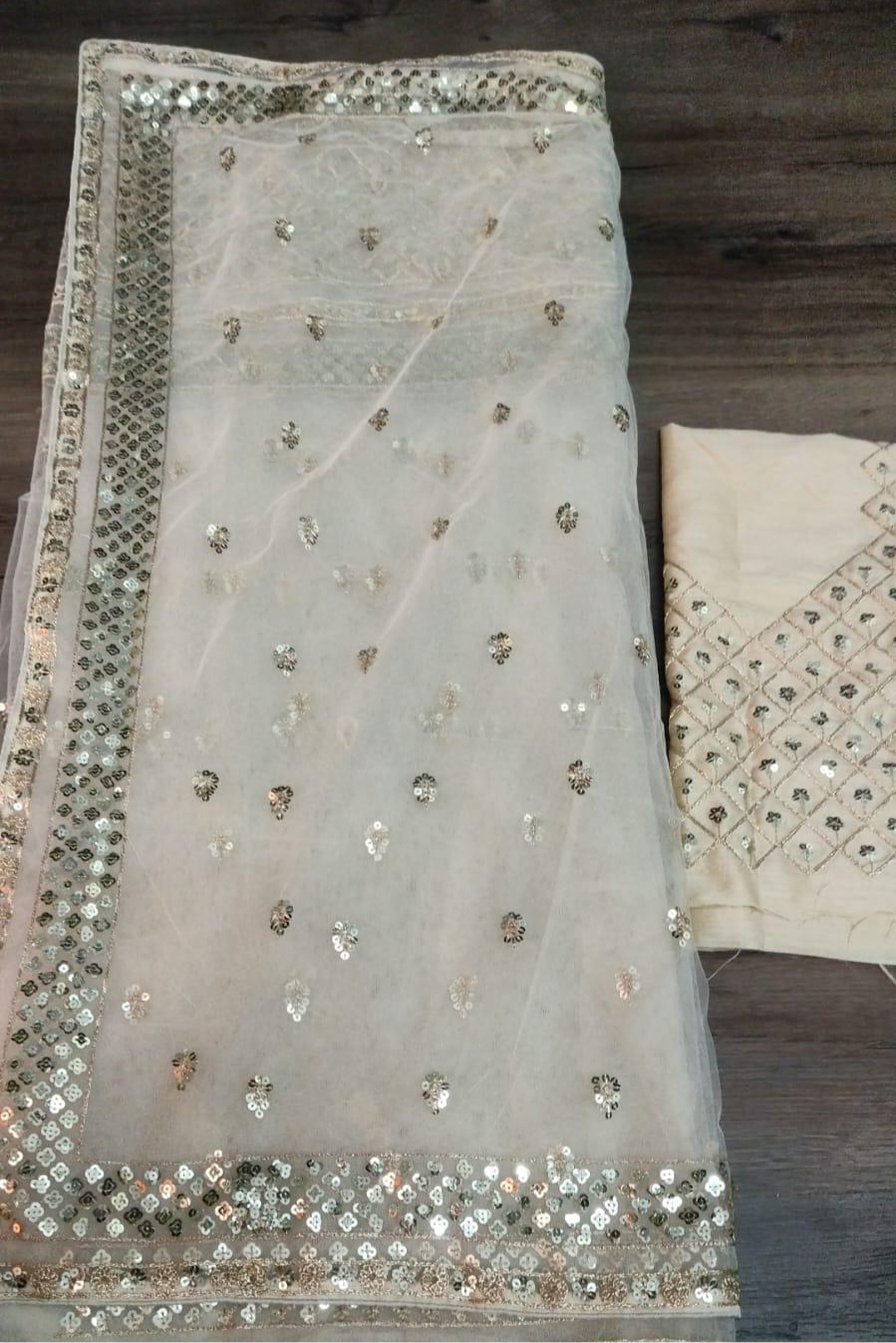 Golden cream stunning Party-wear net sequinned saree