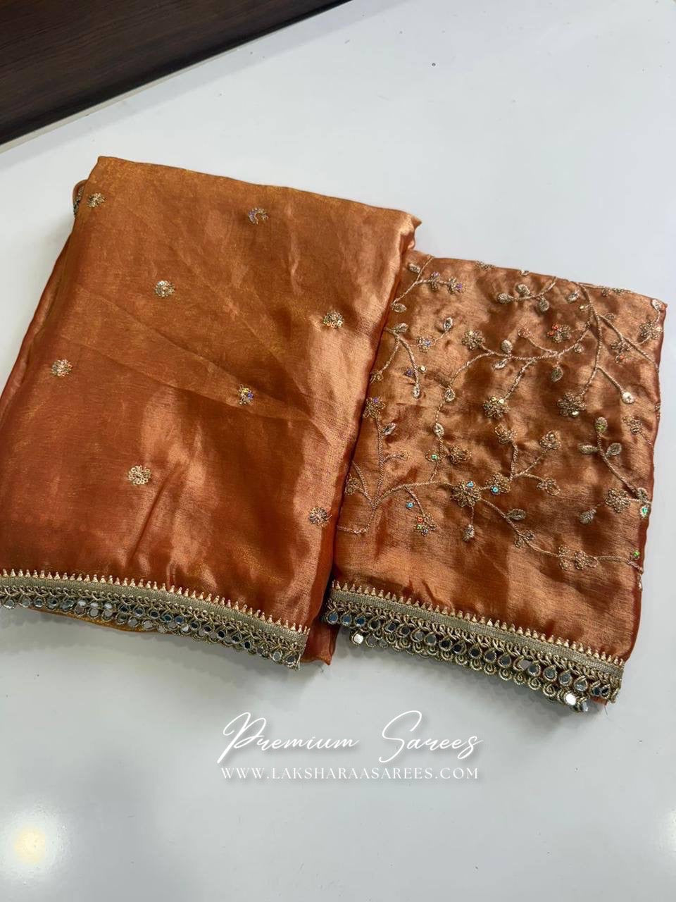 Laksharaa Sarees Swarni shimmer satin saree with embroidered blouse, showcasing elegant fabric and intricate embroidery details.