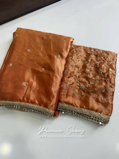 Laksharaa Sarees Swarni shimmer satin saree with embroidered blouse, showcasing elegant fabric and intricate embroidery details.