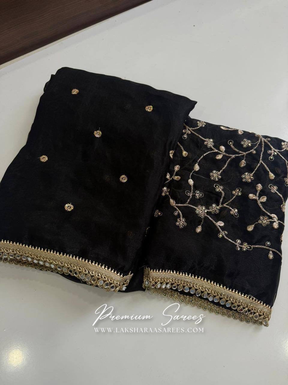 Shimmer satin saree with embroidered blouse by Laksharaa Sarees, showcasing elegant fabric and intricate embroidery details.