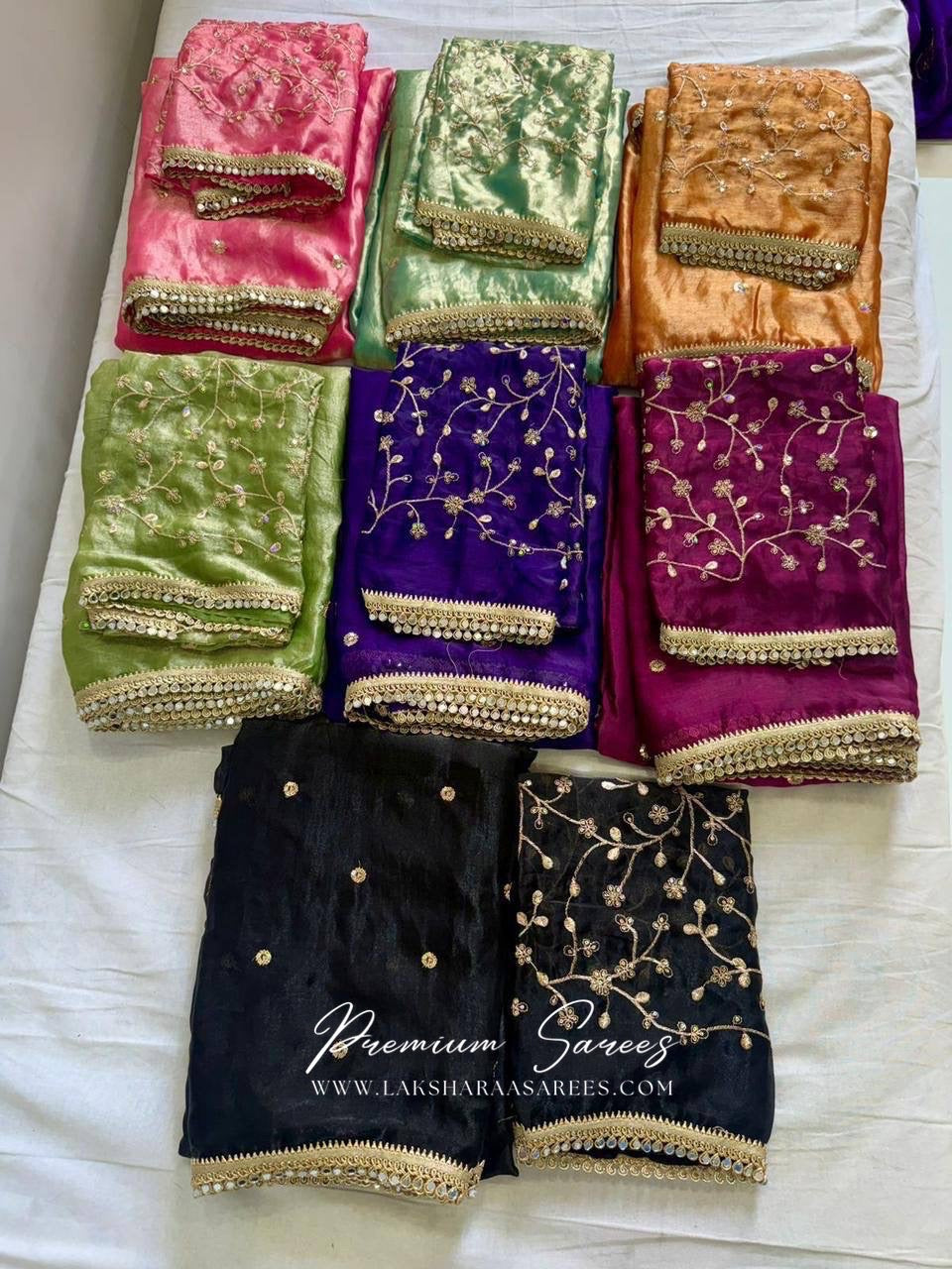 Elegant shimmer satin saree by Laksharaa Sarees paired with an embroidered blouse, showcasing intricate detailing and luxurious fabric.