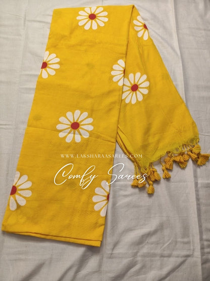 Floral Kadhi Saree with tassels by Laksharaa Sarees, featuring intricate floral patterns and elegant draping.