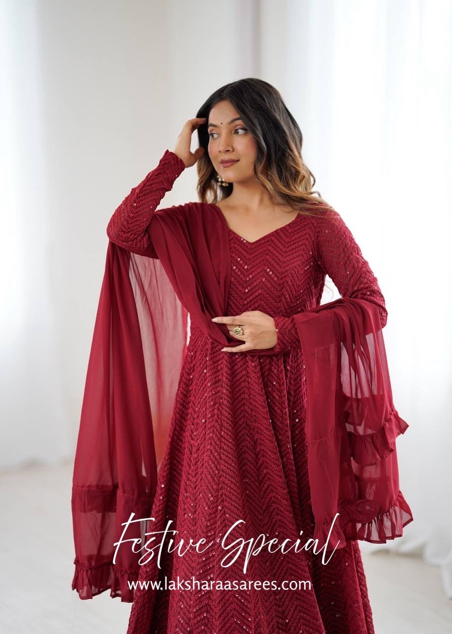 Premium maroon red Anarkali suit by Laksharaa Sarees, featuring intricate embroidery and a flowing silhouette.