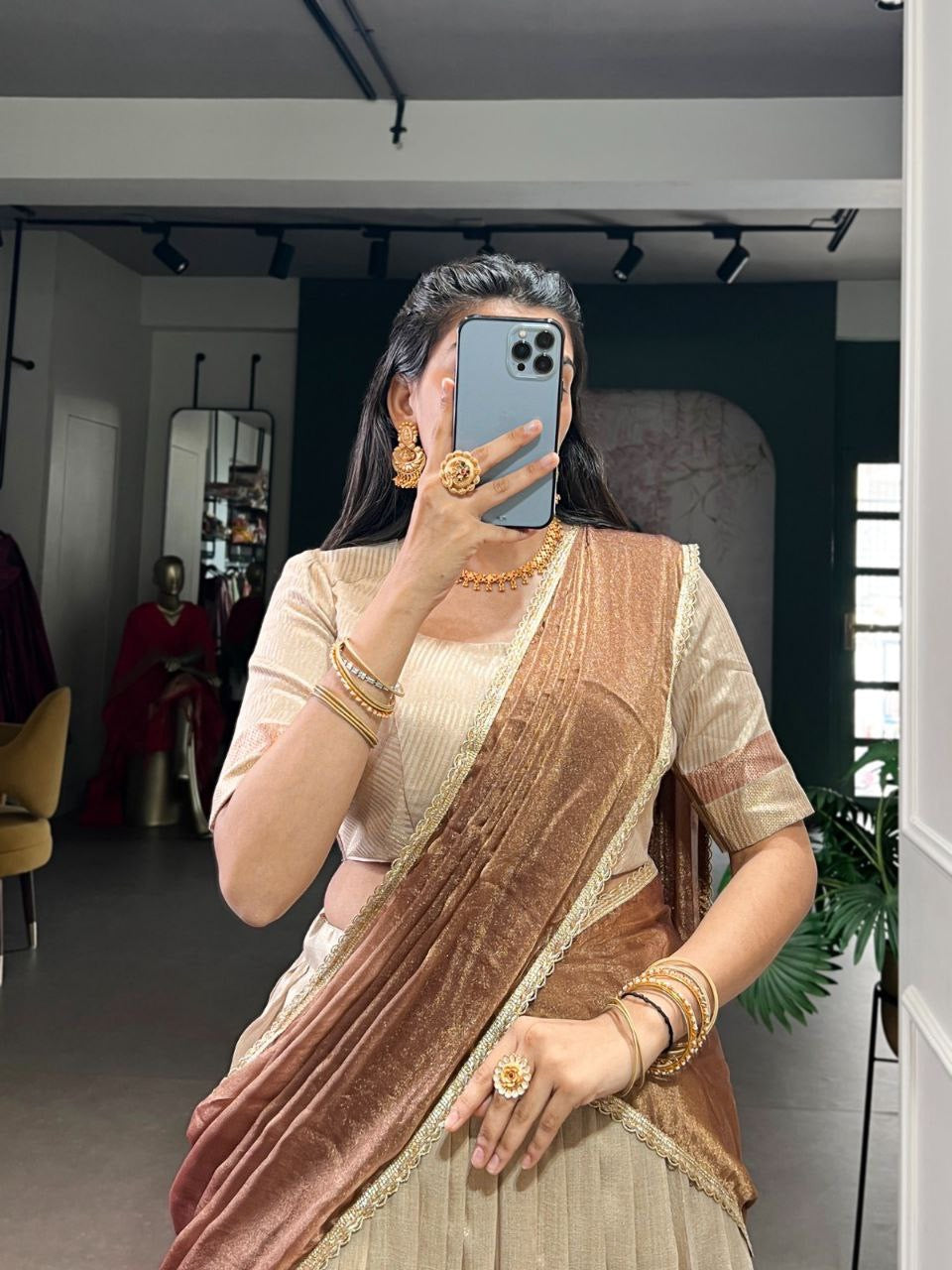Pastel crush silk half saree lehenga by Laksharaa Sarees featuring intricate embroidery and a flowing, elegant design.