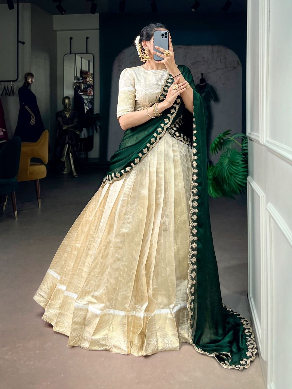 NIVITHA golden and red half saree lehenga by Laksharaa Sarees, featuring intricate embroidery and traditional design.