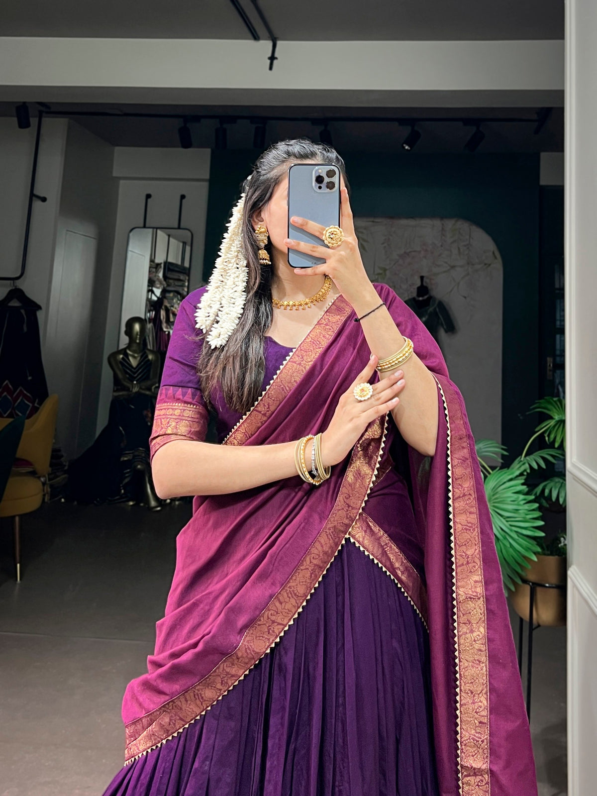 South Indian half saree lehenga by Laksharaa Sarees, featuring intricate embroidery and vibrant traditional design.