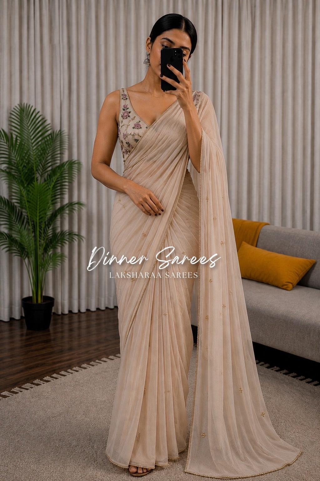 Soft pink georgette dinner saree with floral bloom designs from Laksharaa Sarees, featuring elegant drape and intricate detailing.