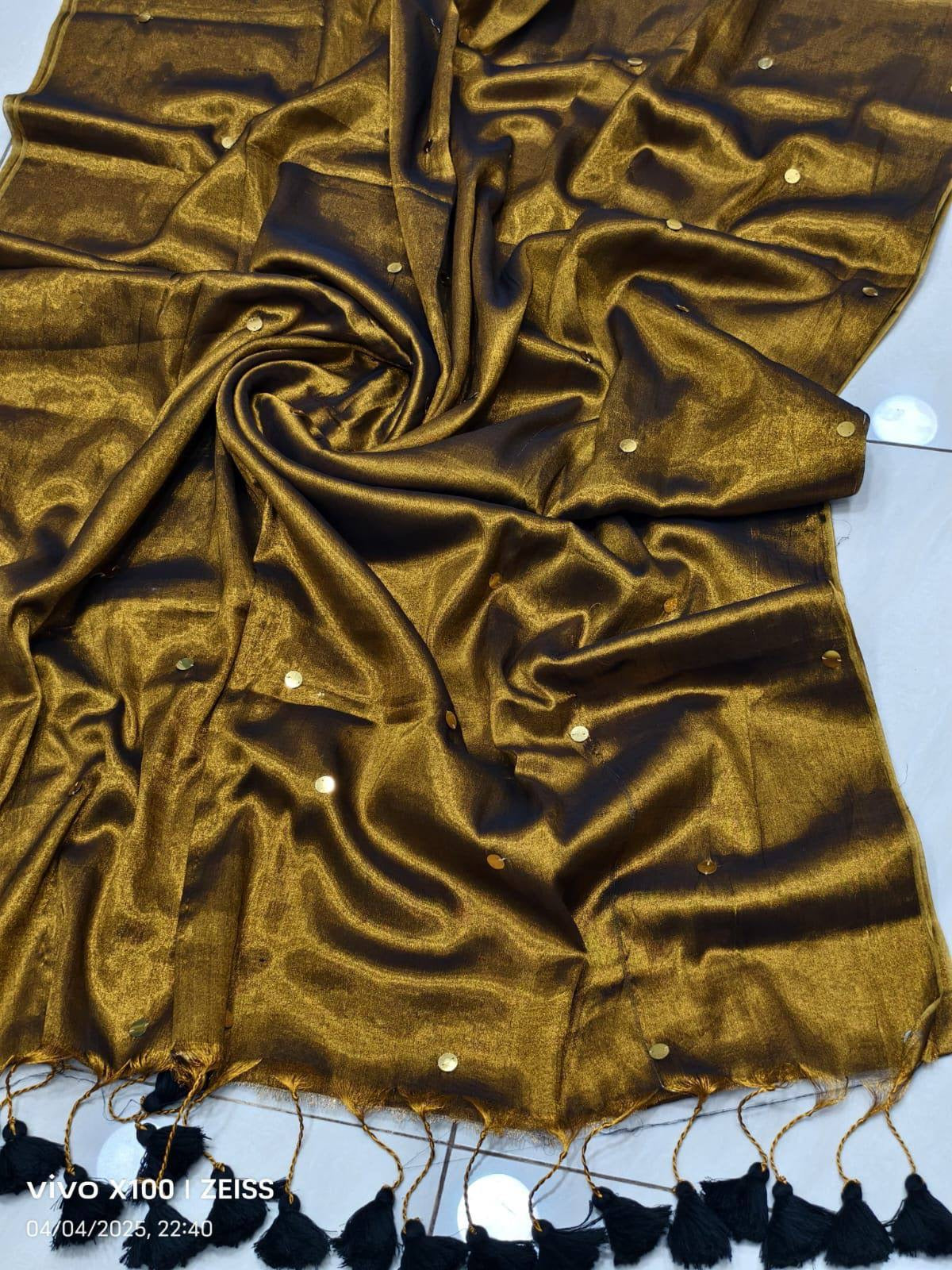 Elegant tissue Raaga saree with pretty tassels from Laksharaa Sarees, featuring intricate design and vibrant colors.