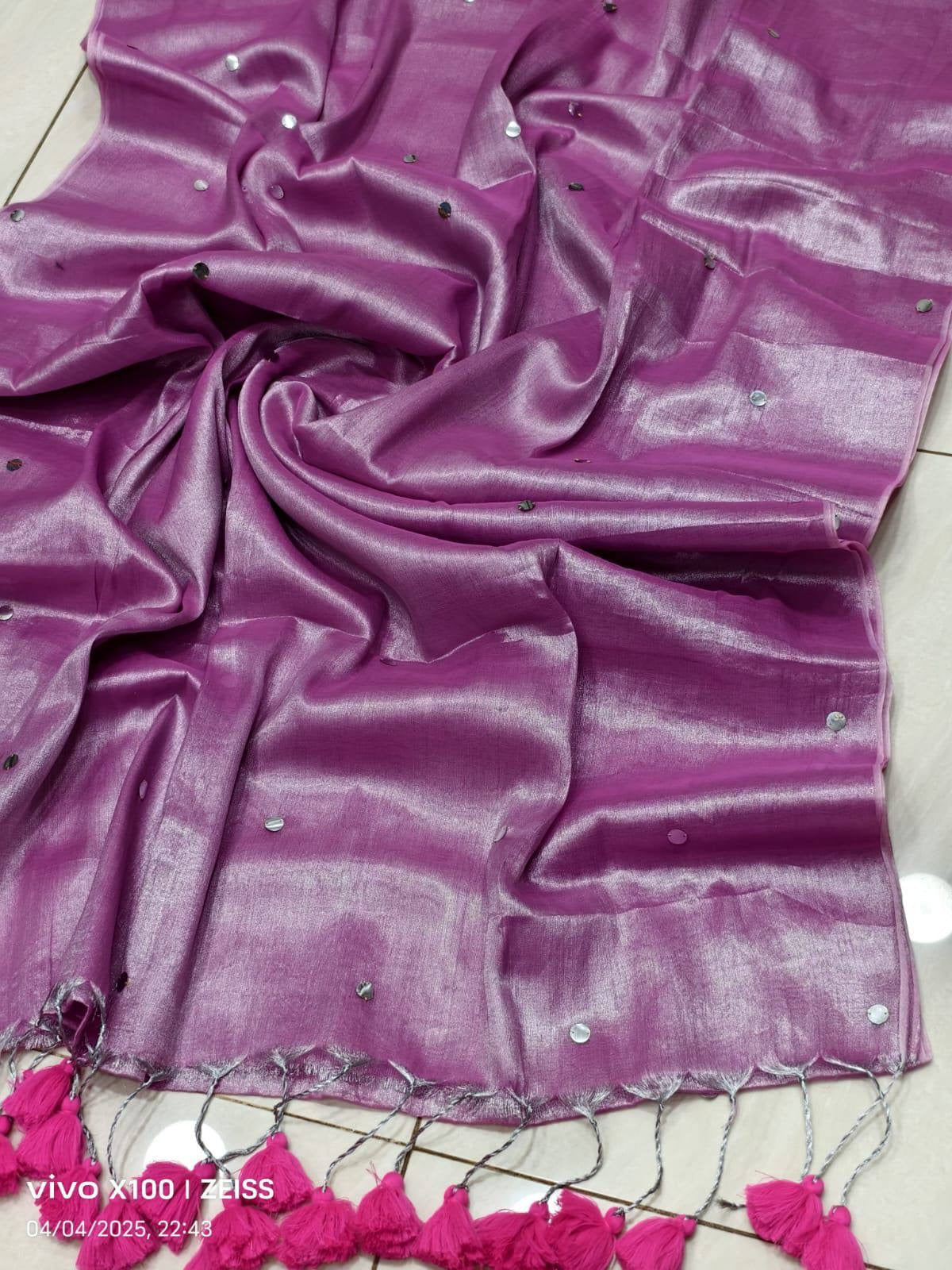 Elegant tissue Raaga saree with pretty tassels by Laksharaa Sarees, featuring intricate fabric and decorative tassel details.