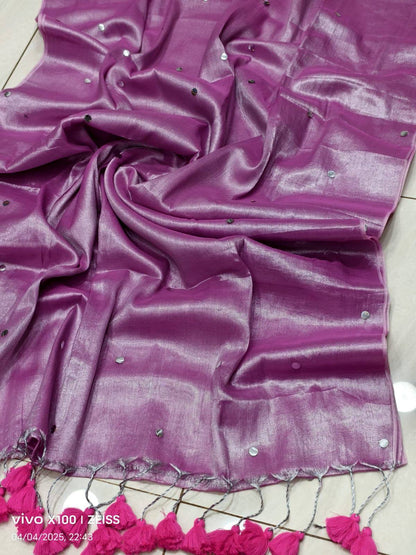Elegant tissue Raaga saree with pretty tassels by Laksharaa Sarees, featuring intricate fabric and decorative tassel details.