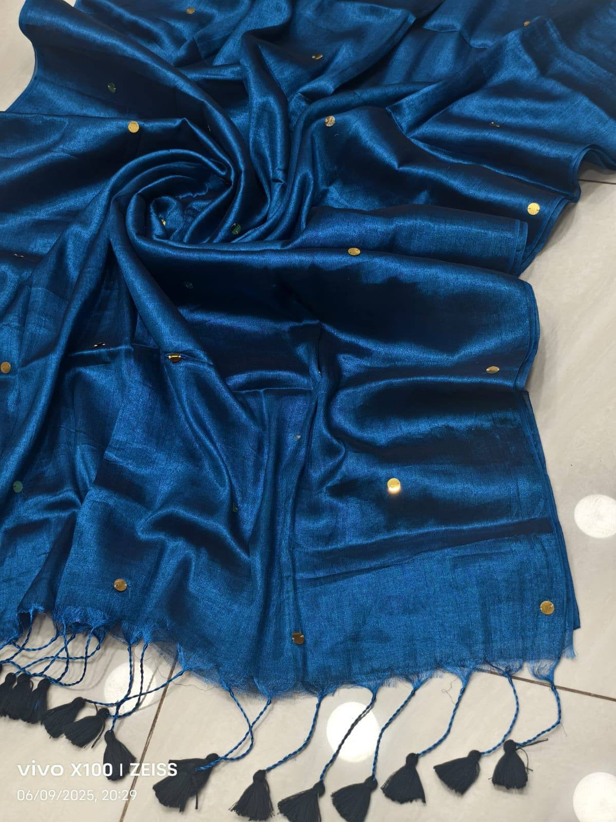 Light blue Tissue Raaga Saree by Laksharaa Sarees with pretty tassel embellishments, draped on a mannequin showing detailed fabric and design