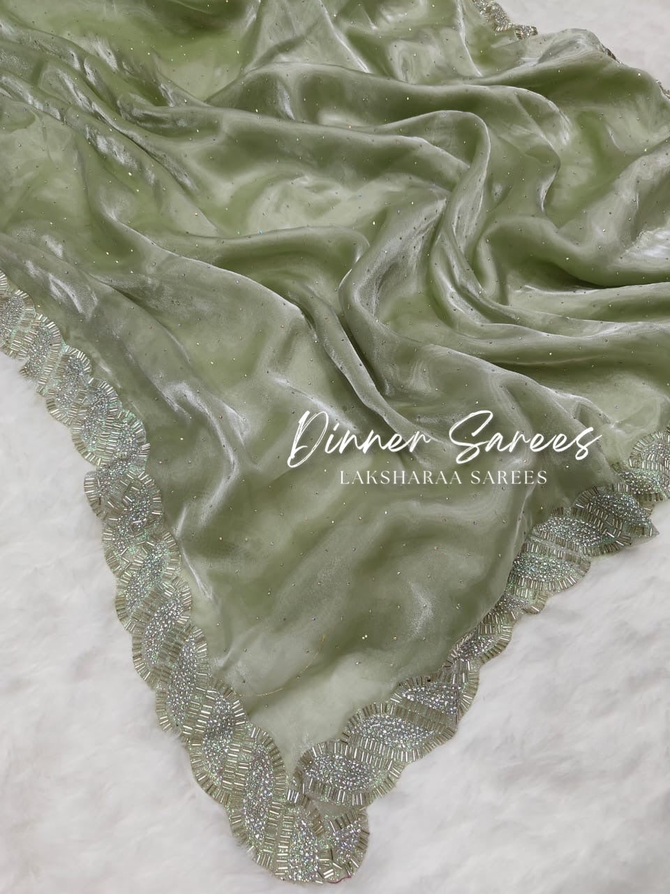 Laksharaa Sarees DREAMI Luxe Shimmer Silk Saree with silver Jarkan border, featuring elegant drape and intricate border detailing.
