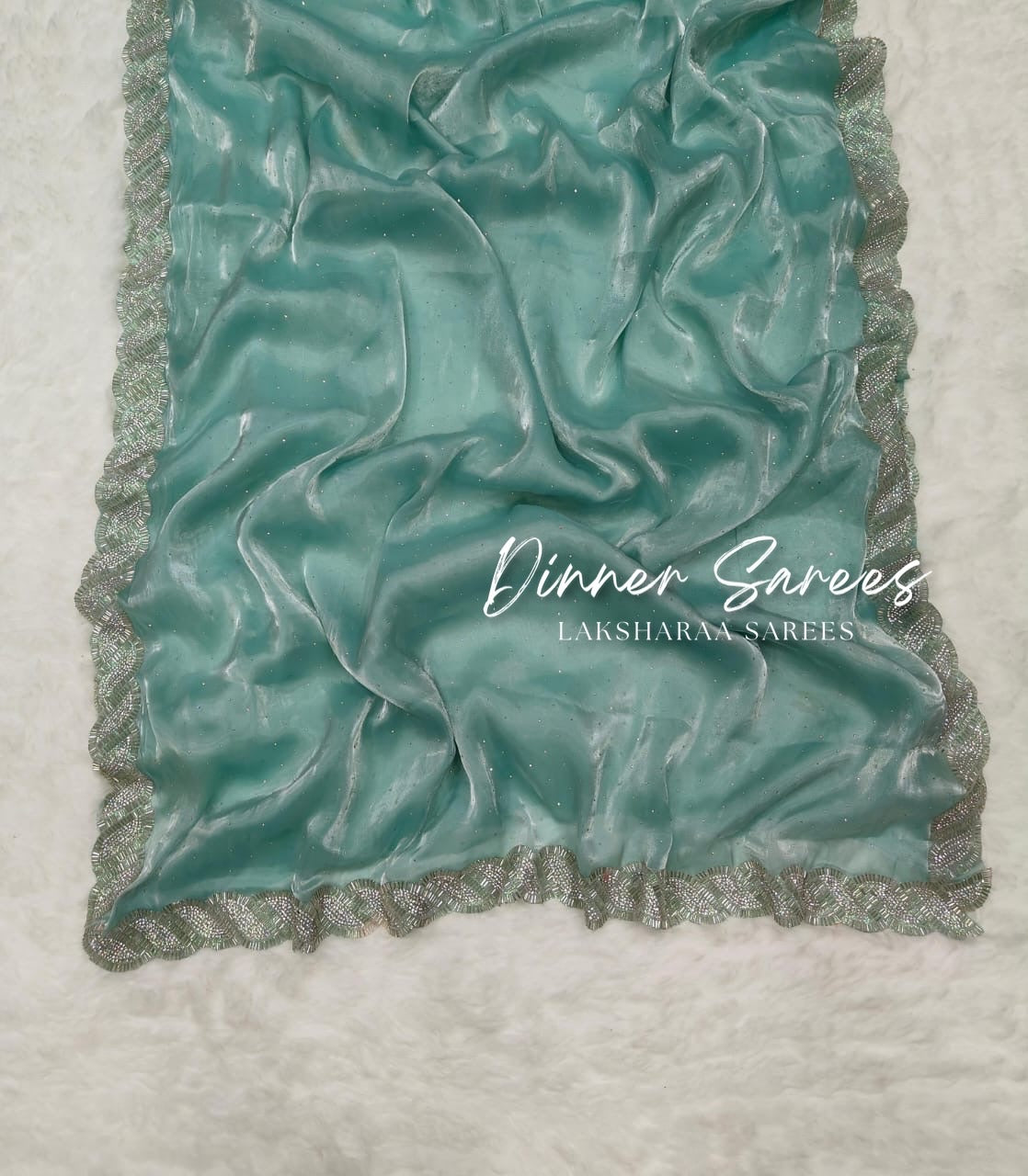 Laksharaa Sarees Luxe Shimmer Silk Saree with silver Jarkan border, featuring elegant silver embroidery and shimmering silk fabric.