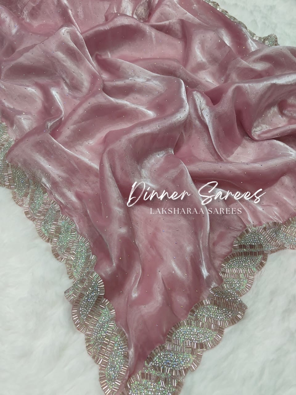 Luxe shimmer silk saree with silver jarkan border from Laksharaa Sarees, showcasing elegant drape and intricate silver embroidery.