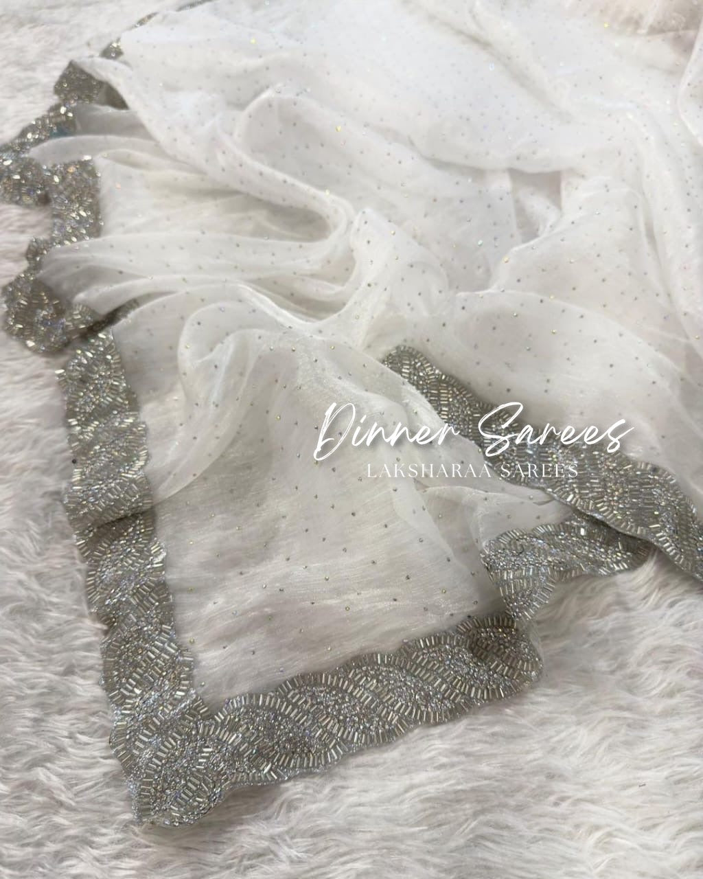 Luxe shimmer silk saree with silver jarkan border from Laksharaa Sarees, showcasing intricate embroidery and elegant drape.