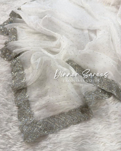 Luxe shimmer silk saree with silver jarkan border from Laksharaa Sarees, showcasing intricate embroidery and elegant drape.