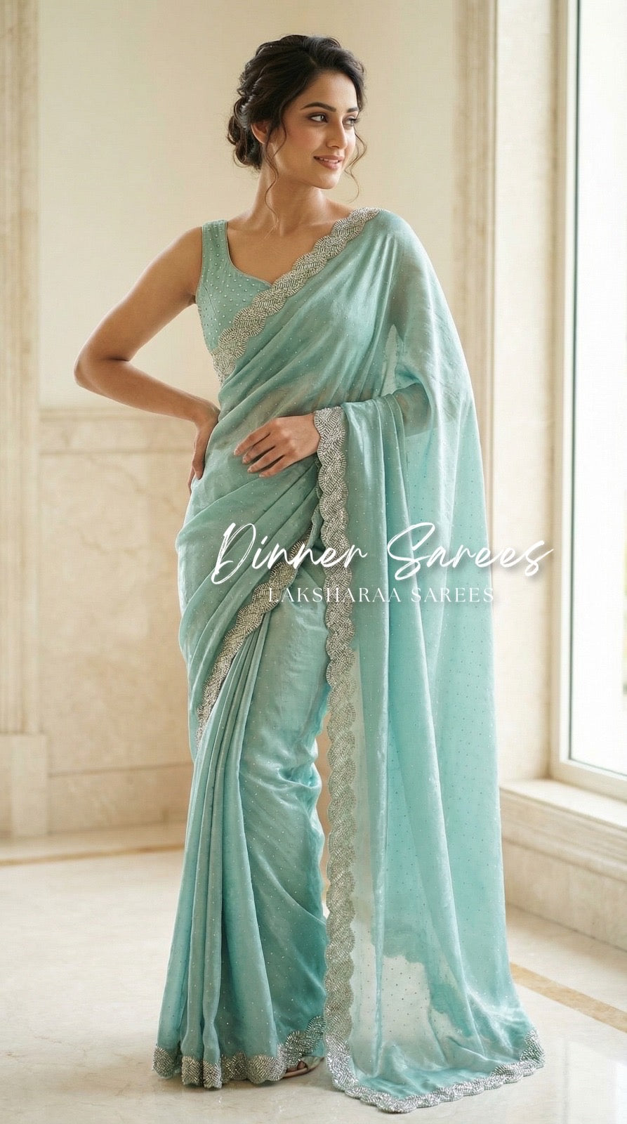 Luxe shimmer silk saree with silver jarkan border by Laksharaa Sarees, featuring intricate traditional embroidery and elegant drape.