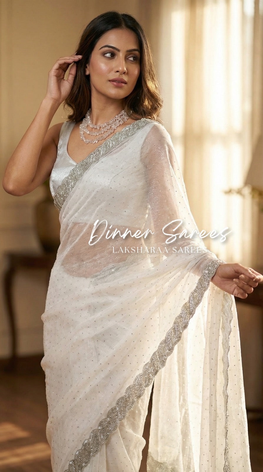 Luxe shimmer silk saree with silver Jarkan border by Laksharaa Sarees, featuring elegant drape and intricate detailing.