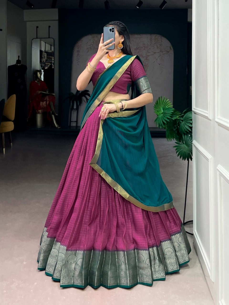 Pink and gold Thamaraa Dola Chex half saree lehenga with intricate embroidery, designed by Laksharaa Sarees.