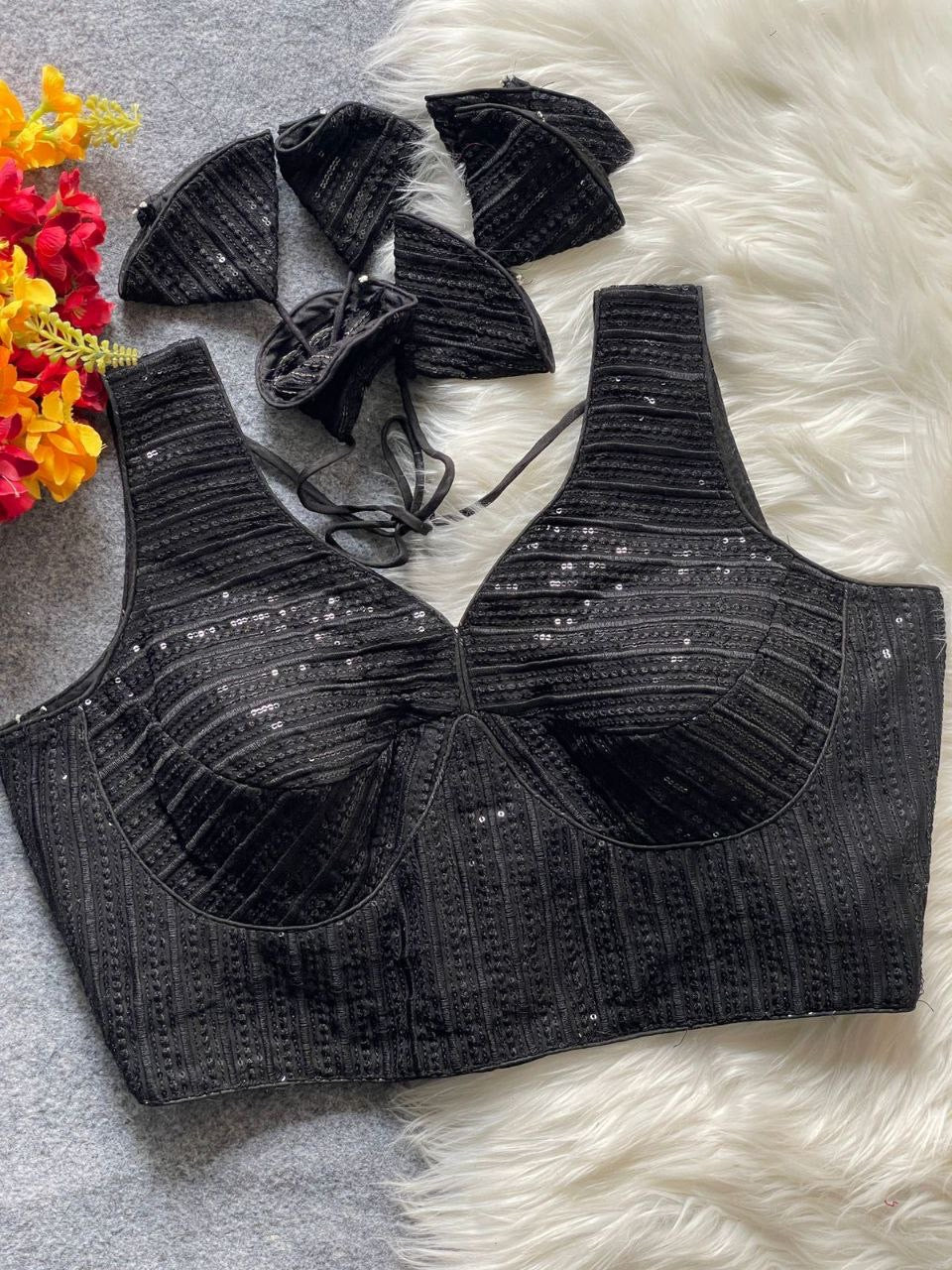 Pink partywear readymade blouse with intricate embroidery, designed by Laksharaa Sarees, featuring detailed craftsmanship and elegant style.