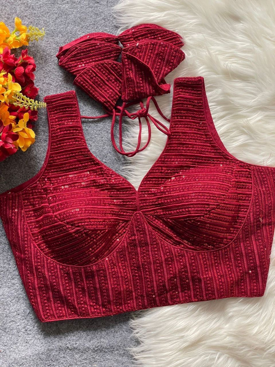 Ruby partywear ready-made blouse by Laksharaa Sarees, featuring intricate embroidery and stylish design on vibrant fabric.