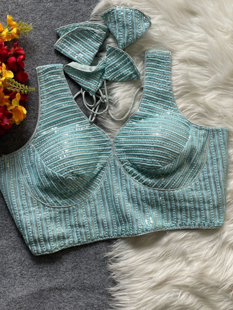 Ruby partywear readymade blouse by Laksharaa Sarees, shown in vibrant fabric with intricate embroidery and stylish design.