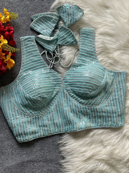 Ruby partywear readymade blouse by Laksharaa Sarees, shown in vibrant fabric with intricate embroidery and stylish design.