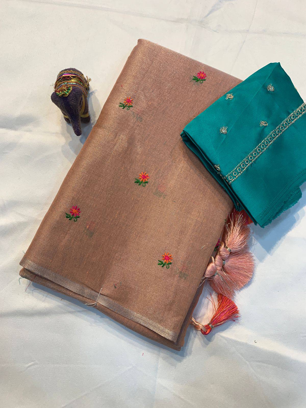 Soft simmer tissue linen saree by Laksharaa Sarees featuring elegant, lightweight fabric with intricate woven patterns.