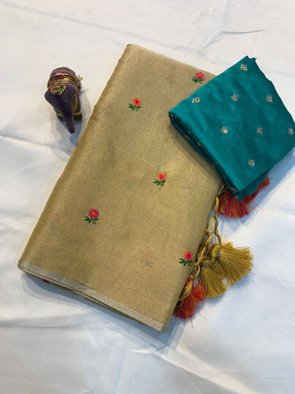 Soft beige tissue linen saree from RUTHRA by Laksharaa Sarees, featuring intricate traditional weaving and elegant drape.