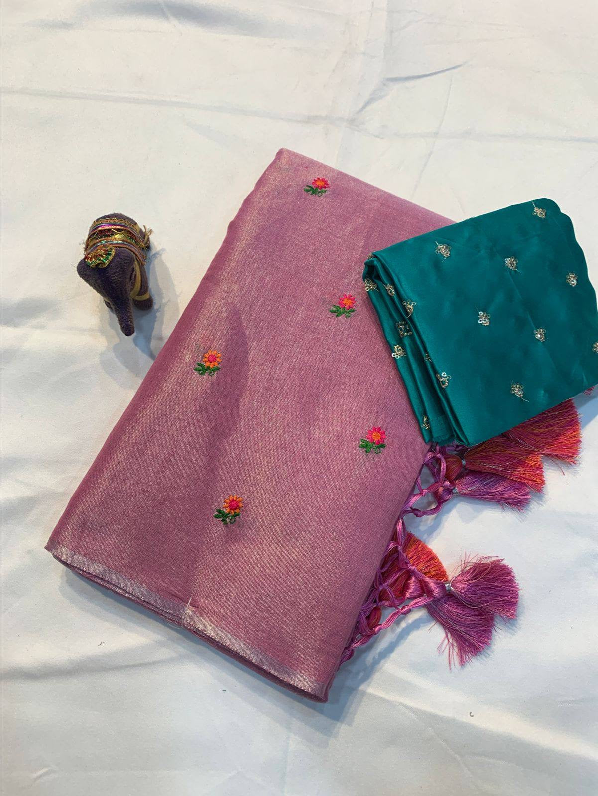 Soft simmer tissue linen saree by Laksharaa Sarees featuring elegant fabric and intricate detailing in a traditional Indian style.