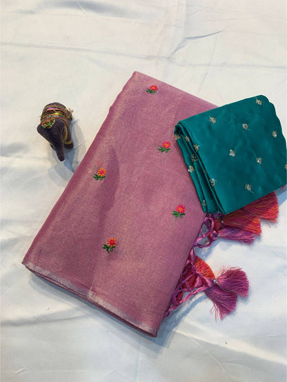 Soft simmer tissue linen saree by Laksharaa Sarees featuring elegant fabric and intricate detailing in a traditional Indian style.