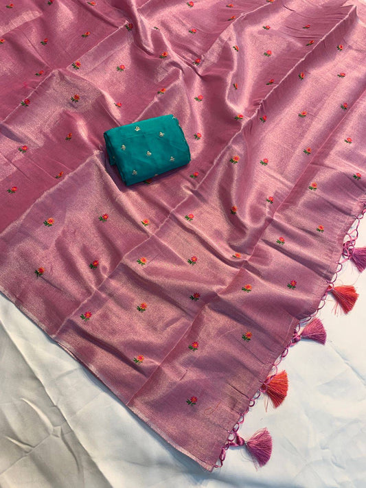 Soft simmer tissue linen saree by Laksharaa Sarees featuring elegant, lightweight fabric with intricate designs and a graceful drape.