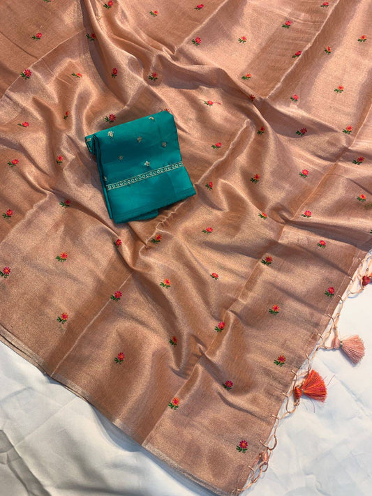 Soft simmer tissue linen saree by Laksharaa Sarees featuring elegant, lightweight fabric with subtle sheen and intricate detailing.