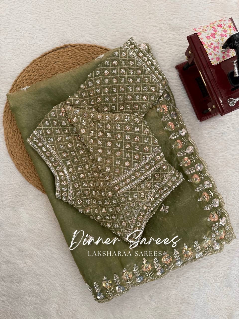 Alisa Georgette dinner saree by Laksharaa Sarees featuring an embroidered border and elegant drape with intricate detailing.