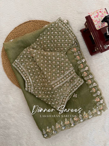 Alisa Georgette dinner saree by Laksharaa Sarees featuring an embroidered border and elegant drape with intricate detailing.