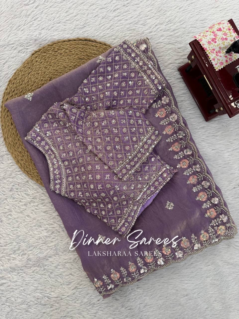 Elegant georgette dinner saree with embroidered border from Laksharaa Sarees, showcasing intricate detailing and flowing fabric.