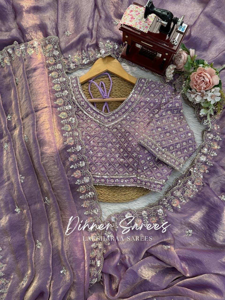Elegant georgette dinner saree by Laksharaa Sarees with intricate embroidered border and flowing drape.