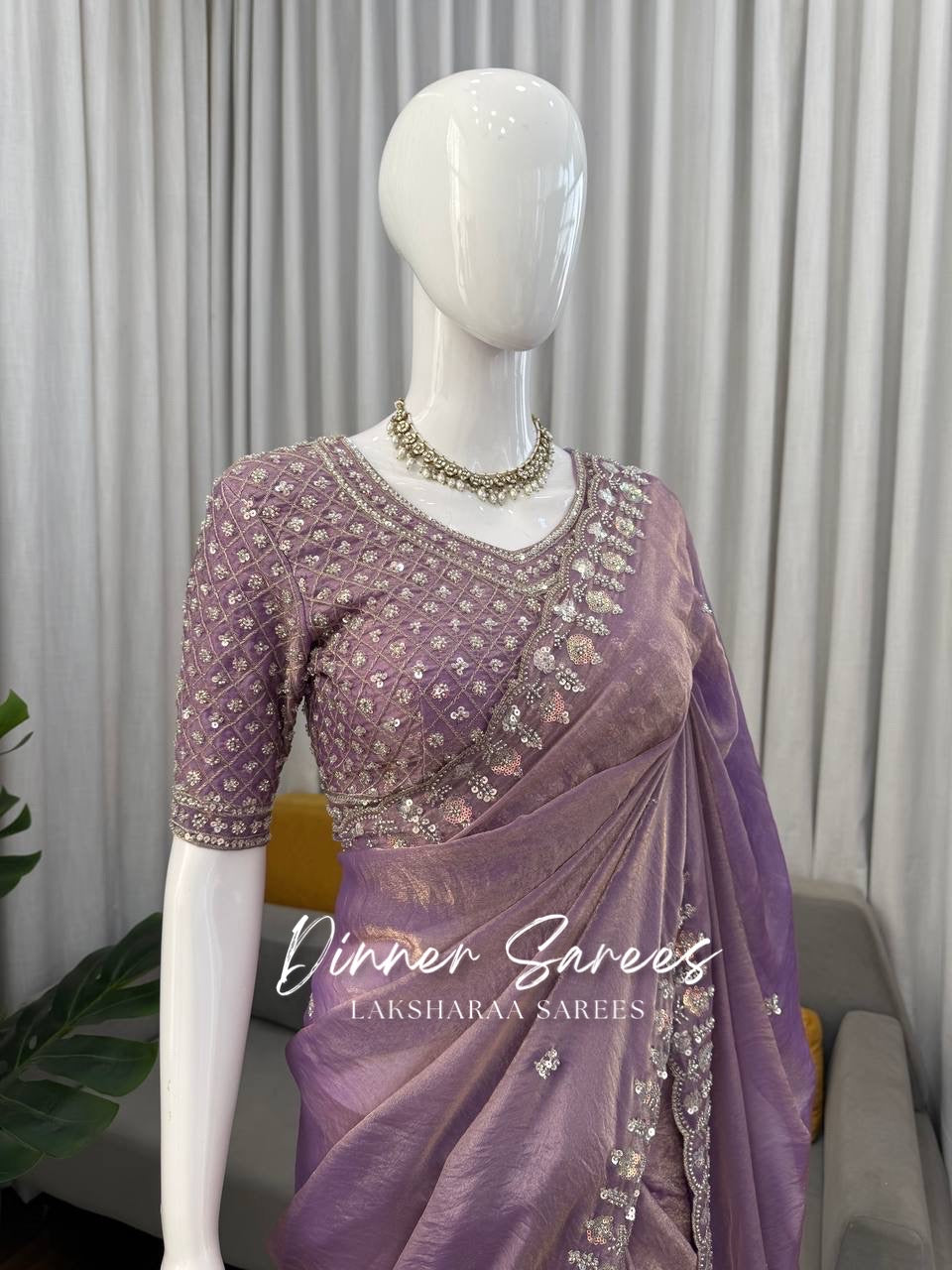 Alisa Georgette dinner saree by Laksharaa Sarees featuring an embroidered border and elegant drape in rich fabric.