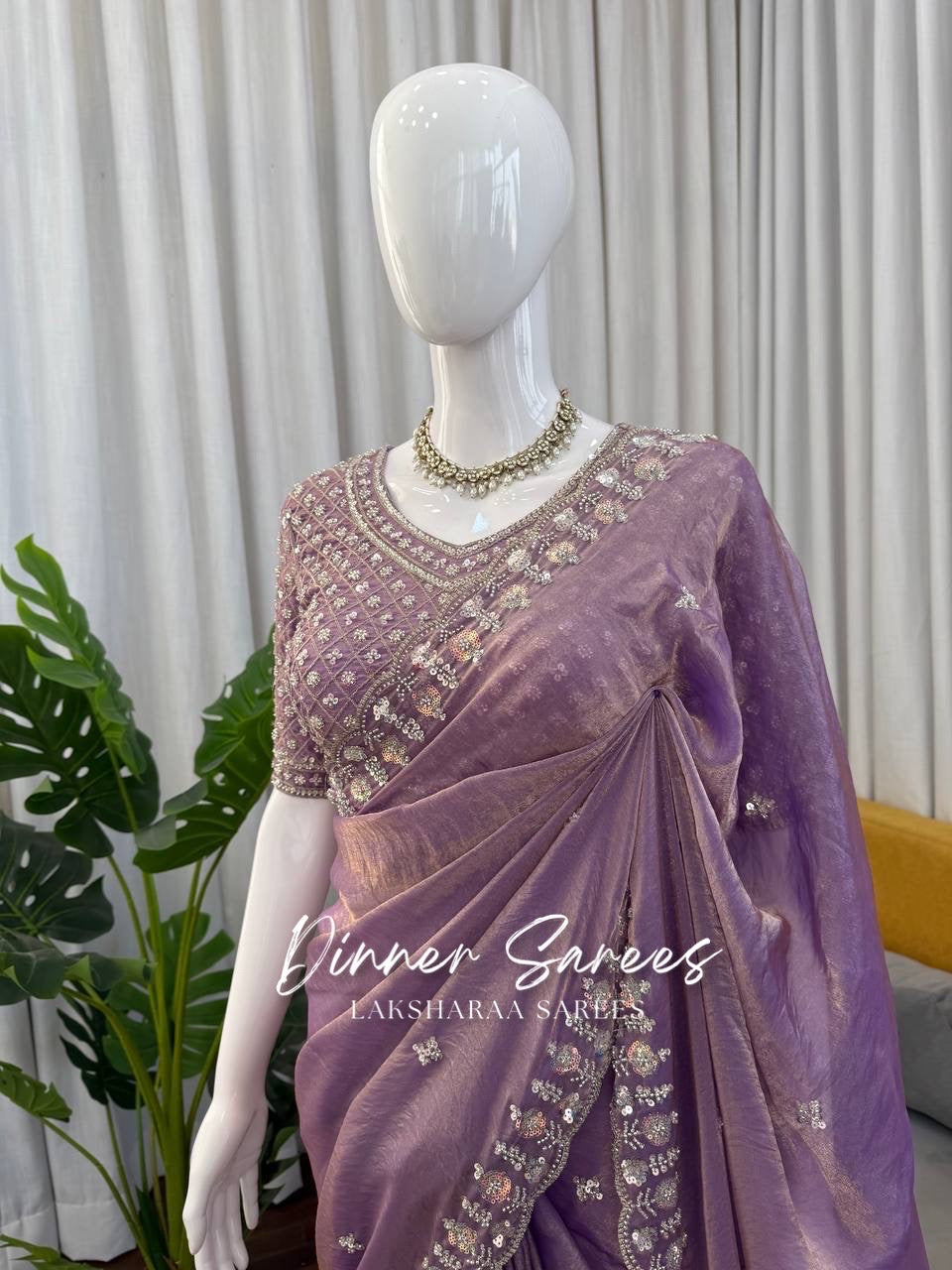 Alisa Georgette dinner saree by Laksharaa Sarees with embroidered border and elegant drape, shown in a detailed close-up image.